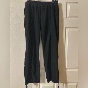 Women’s black joggers with pockets and tie ankle closure